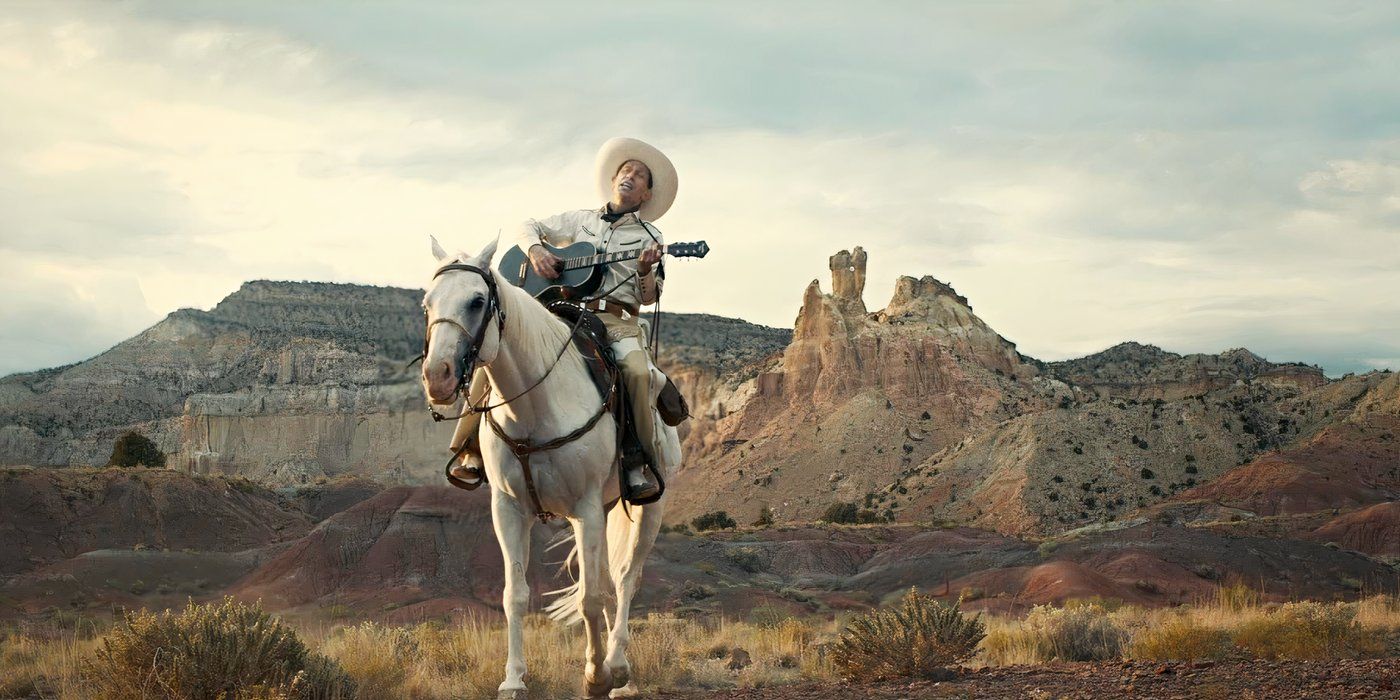 Buster Scruggs, riding a white horse, playing a guitar, and singing in The Ballad of Buster Scruggs