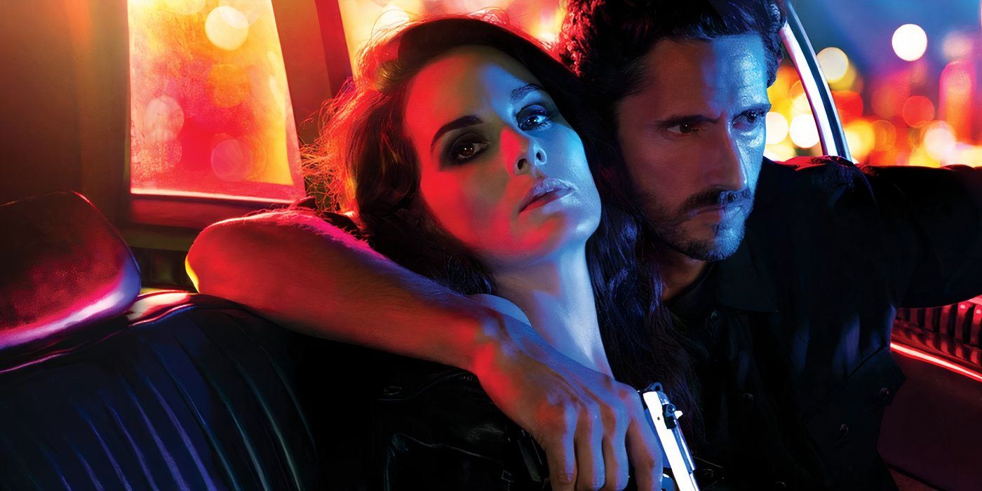 Michelle Dockery and Juan Diego Botto as Lettie and Javier sitting in a car holding a gun in 'Good Behavior'