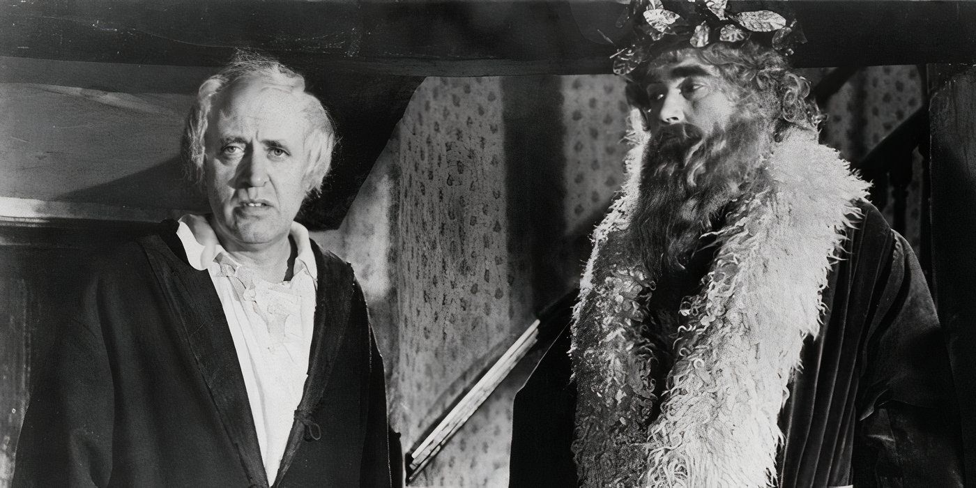  Scrooge and the Ghost of Christmas Present looking in the same direction in A Christmas Carol