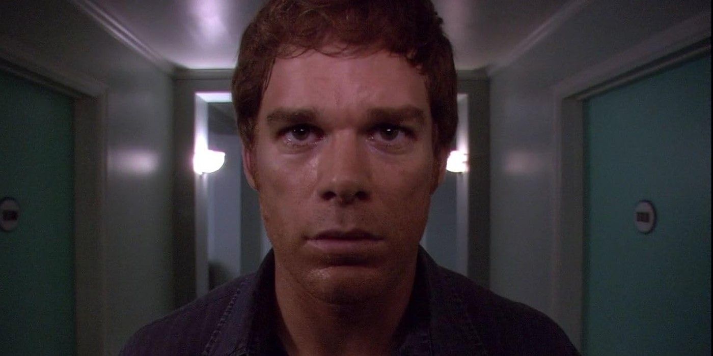 close-up of stressed and sweaty Dexter in an apartment hallway