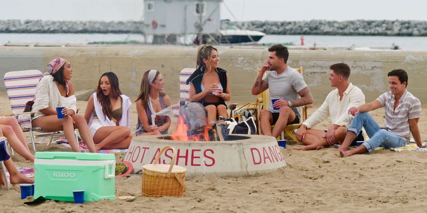 Brandi Marshall, Lauren Brito, Polly Brindle, Alex Hall, Tyler Stanaland, Austin Victoria, Gio Helou sit on the beach in 'Selling The OC' Season 3