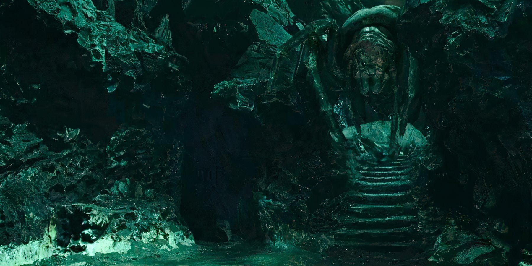 The giant spider Shelob lurks in the shadows of her lair in The Lord of the Rings: The Return of the King.