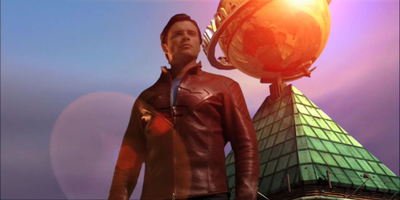 Clark standing in front of the Daily Planet in a red leather Superman jacket in Smallville