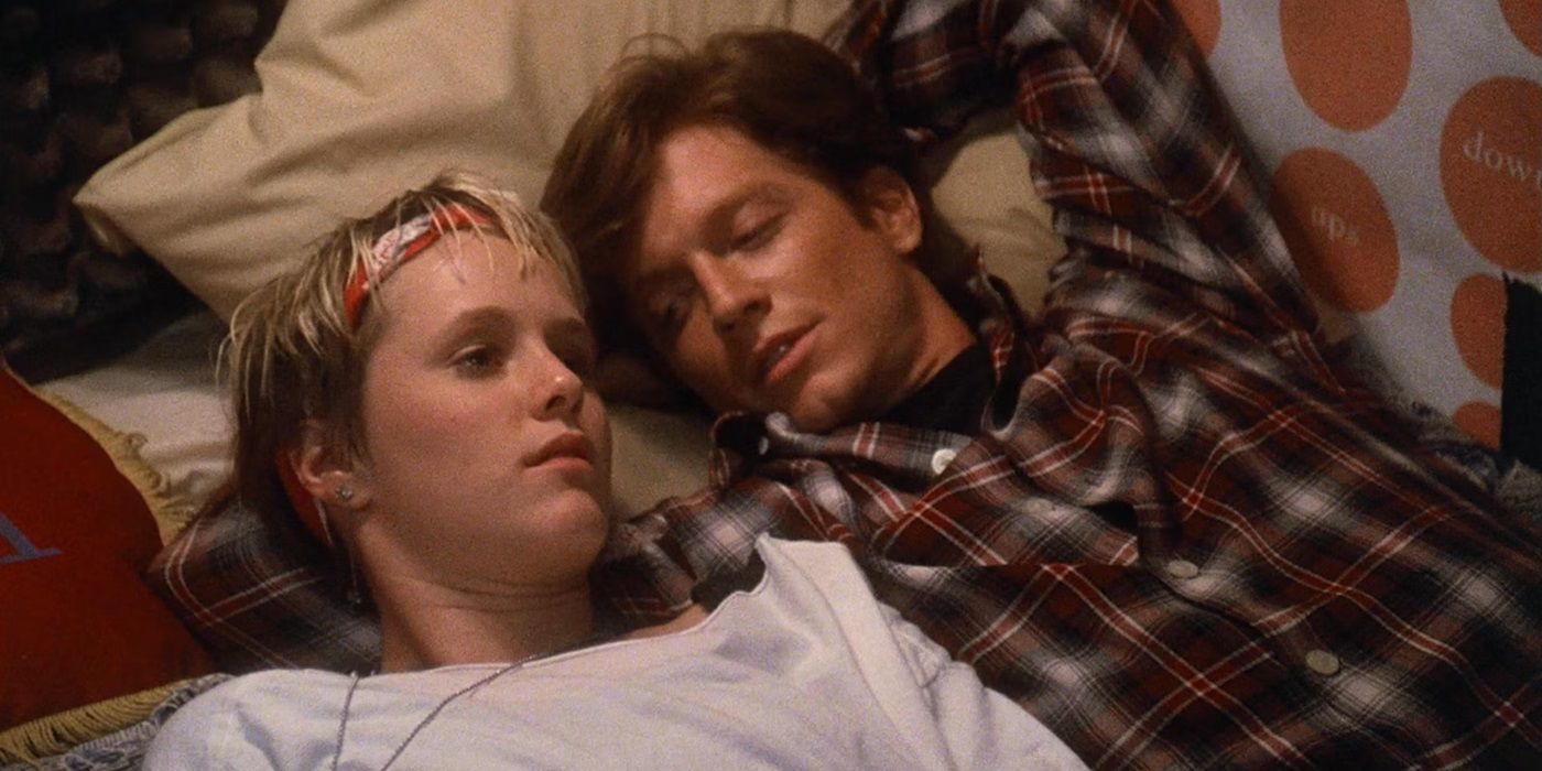 Eric Stoltz as Keith and Mary Stuart Masterson as Watts lying on a bed together in Some Kind of Wonderful