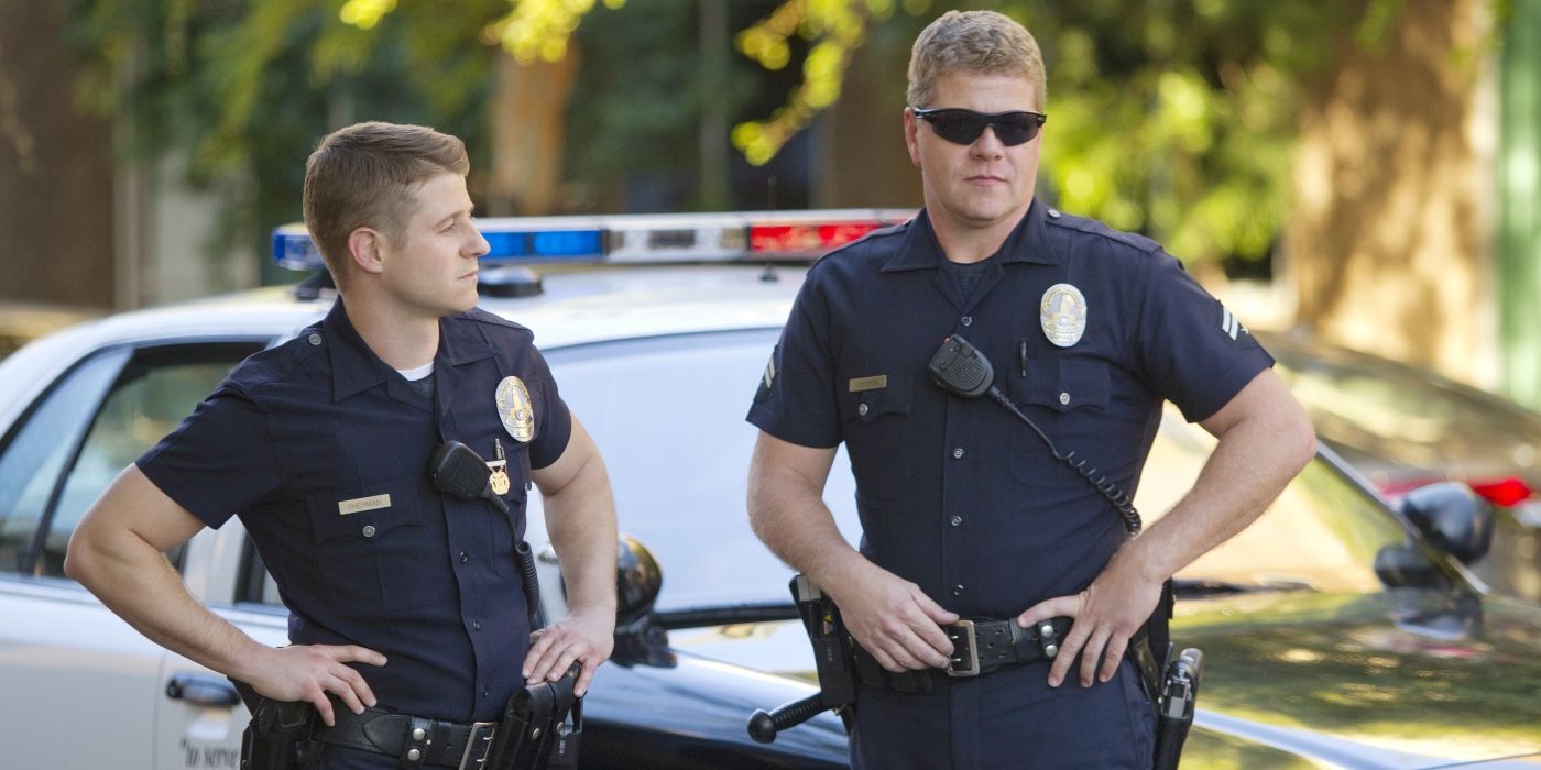 Ben McKenzie and Michael Cudlitz in police uniforms in front of a cop car in &lsquo;Southland.'