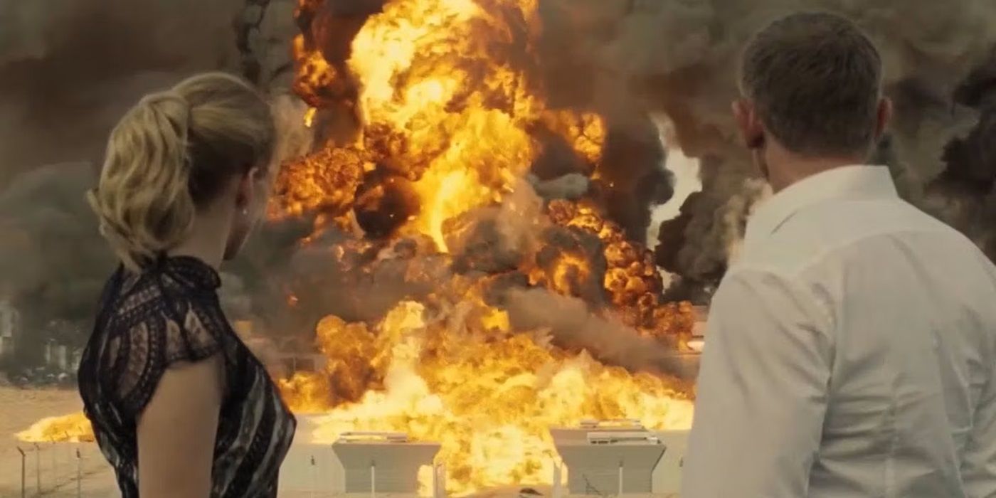 Madeleine Swann (Léa Seydoux) and James Bond (Daniel Craig) look back at an explosion in 'Spectre'
