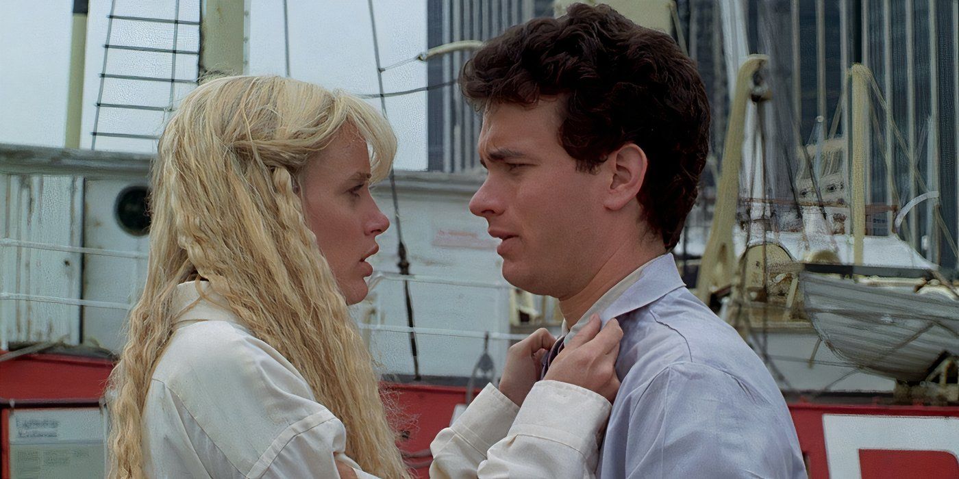 Darryl Hannah with her hands on Tom Hanks' collar as they stare at one another in Splash.