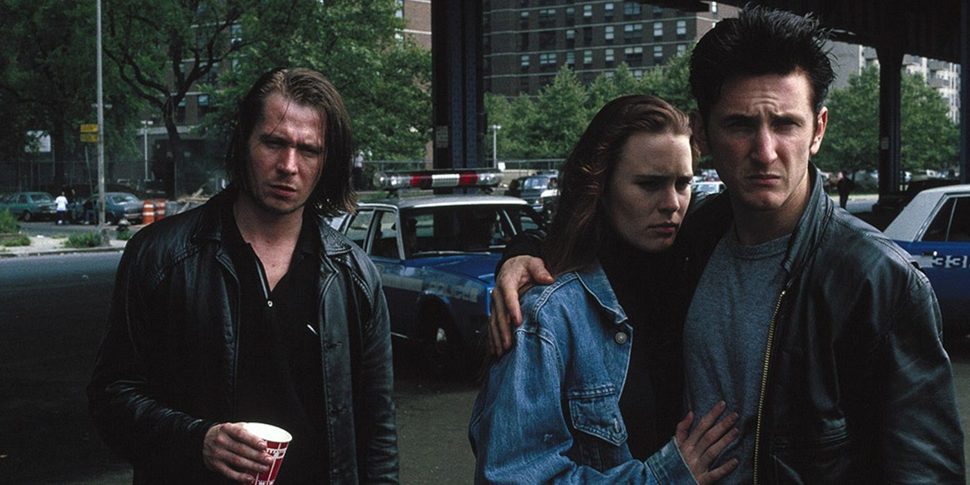 Sean Penn, Robin Wright, and Sean Penn standing together outside in State of Grace