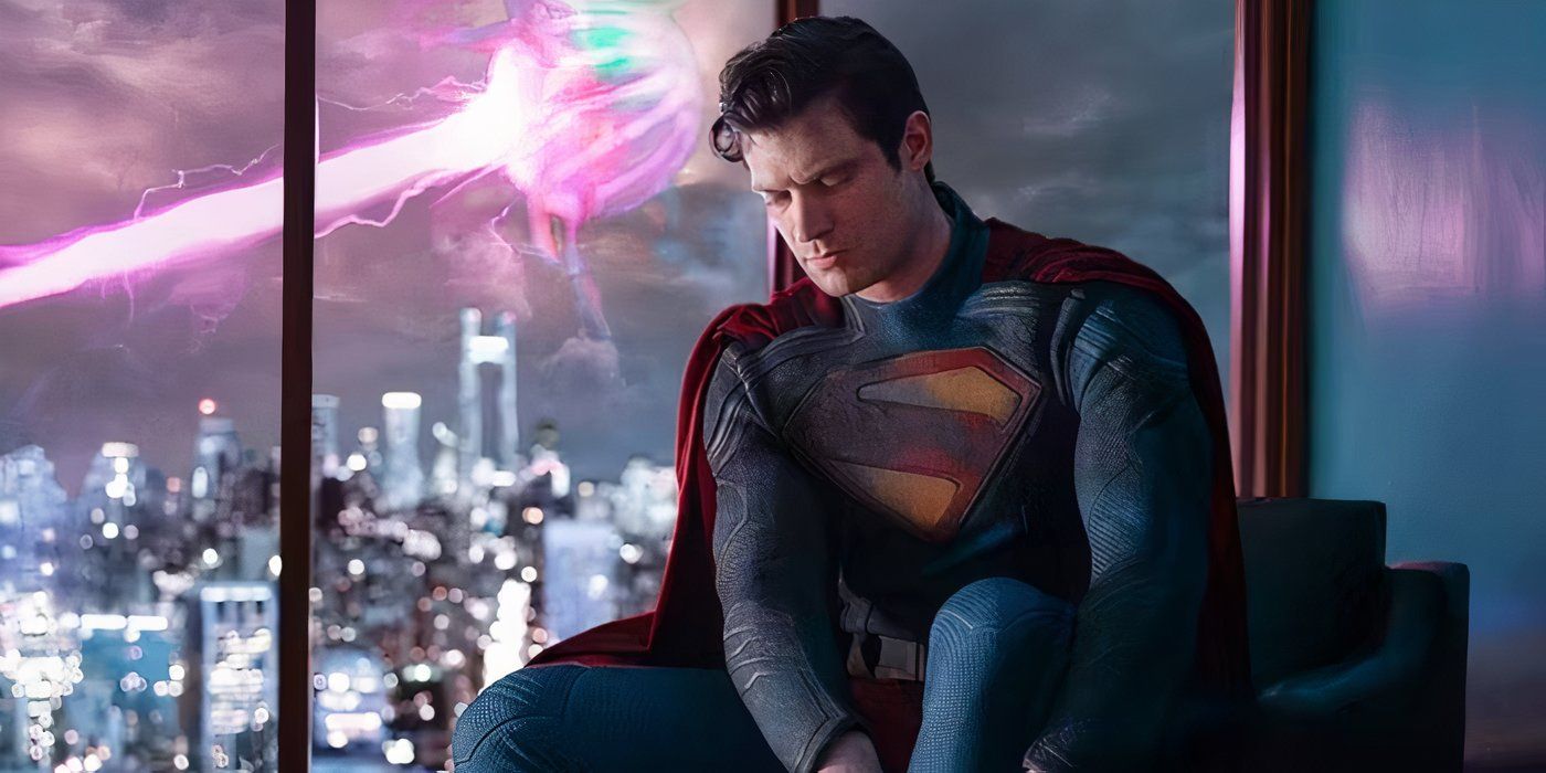 David Corenswet wearing the Superman costume and putting on a red boot in first look image.