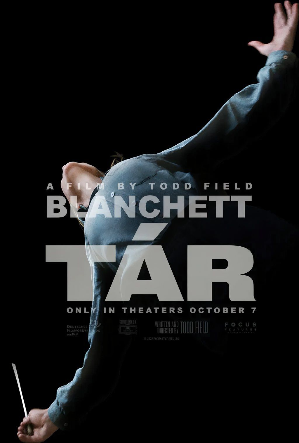 Lydia Tár, played by actor Cate Blanchett, spreads her arms wide, conducting an orchestra in the poster for Tár.