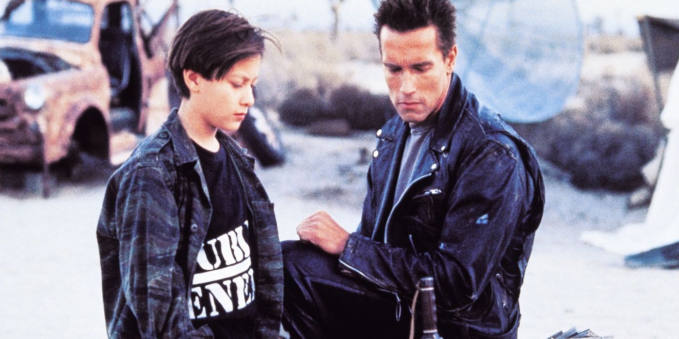 John Connor and The T-800 looking down at something in Terminator 2: Judgment Day