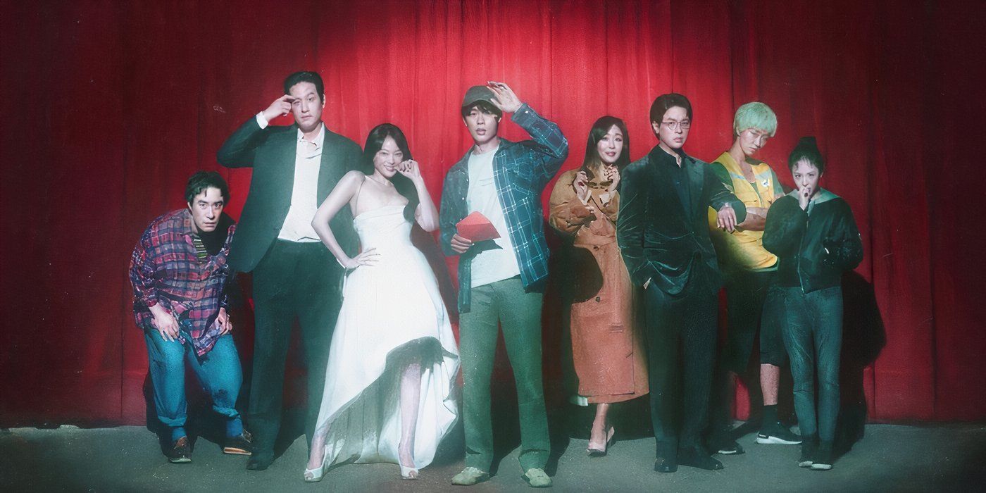 The cast of The 8 Show standing on stage in front of a red curtain