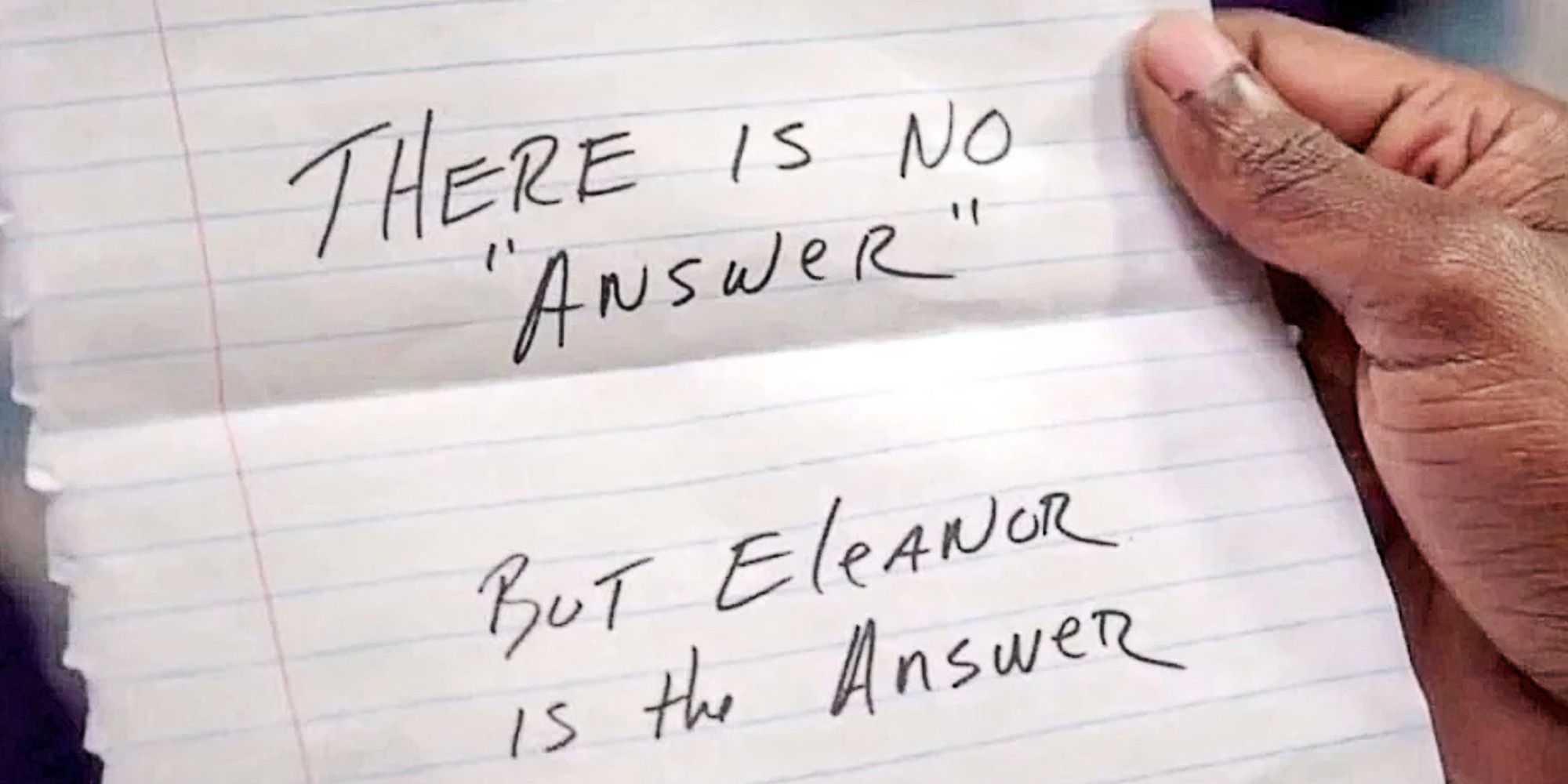 A note that reads: 'THERE IS NO "ANSWER" BUT EleANOR IS the ANSWER' held by Chidi Anagogne in The Good Place