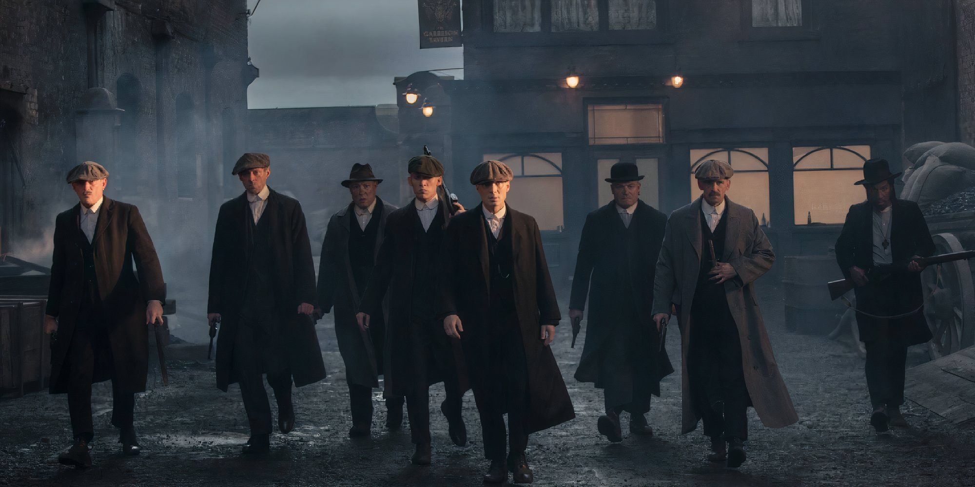 The cast of Peaky Blinders walking side by side ready for a fight.