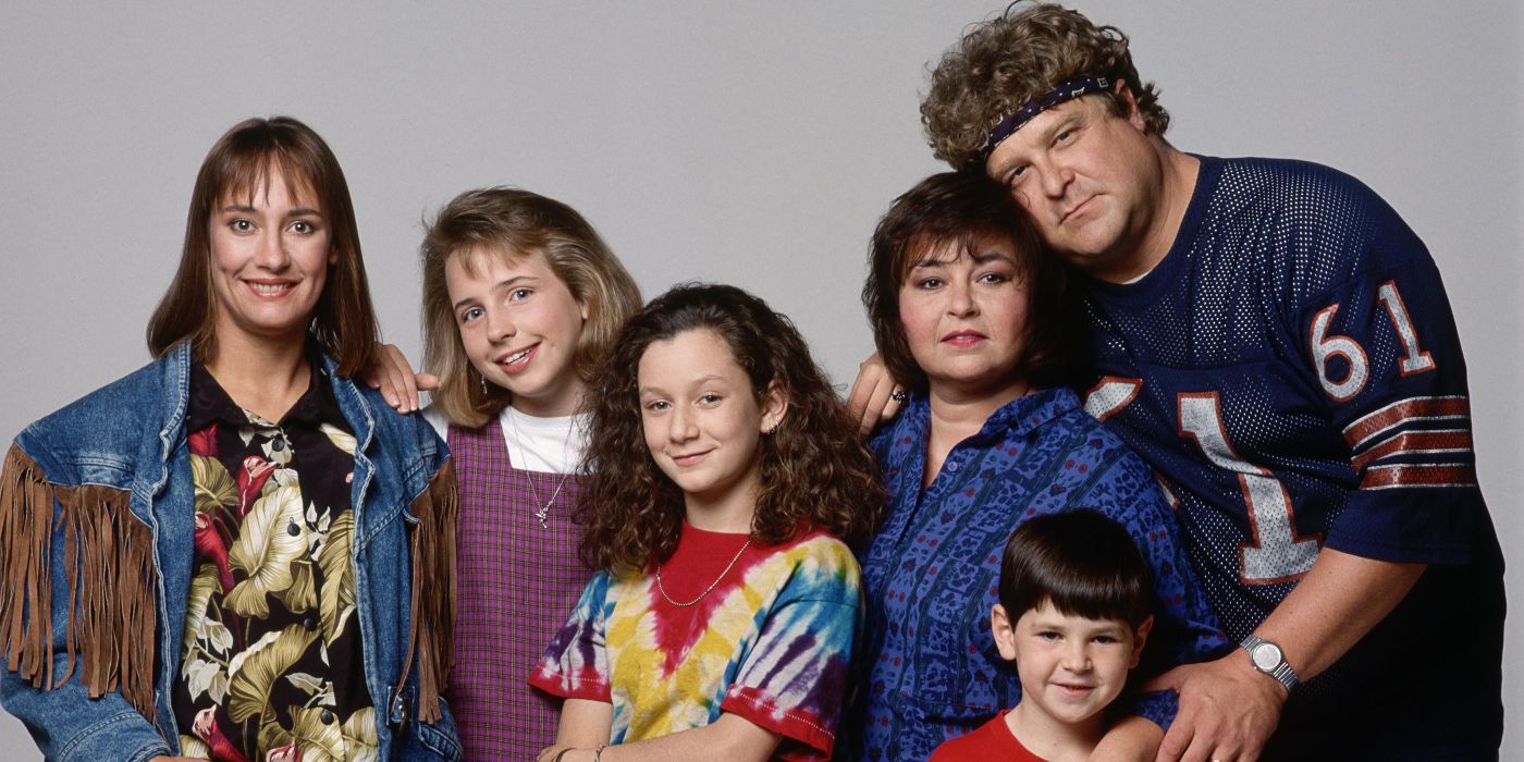 The Conners posing together for a promotional photo for Roseanne