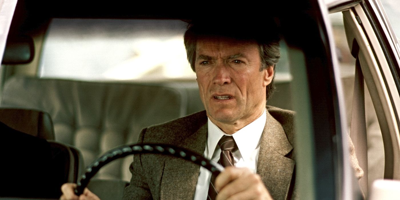Clint Eastwood as Harry Callahan, driving a car and looking worried in The Dead Pool