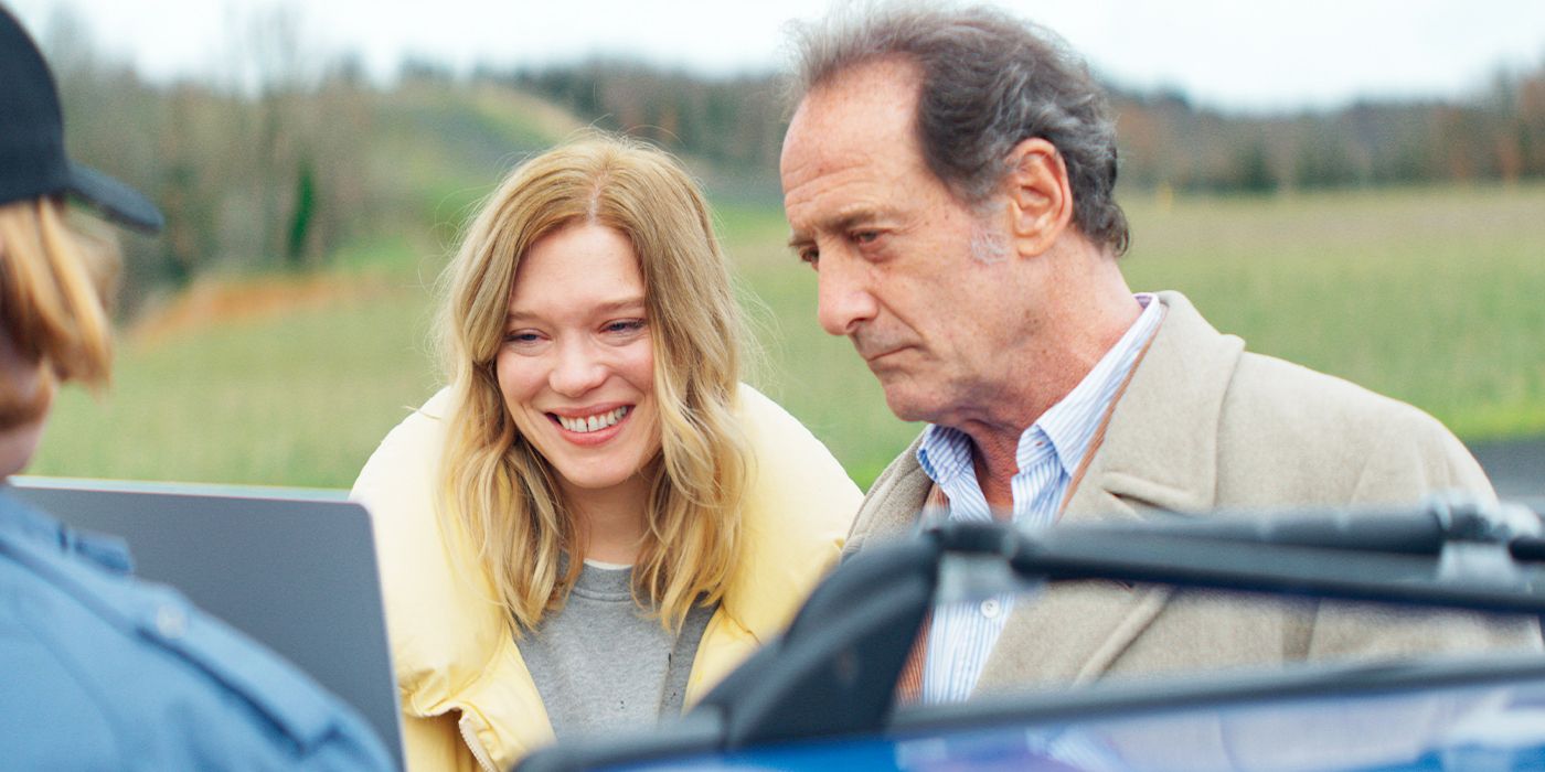 Léa Seydoux as Florence and Vincent Lindon as Guillaume staring at a screen in The Second Act. 