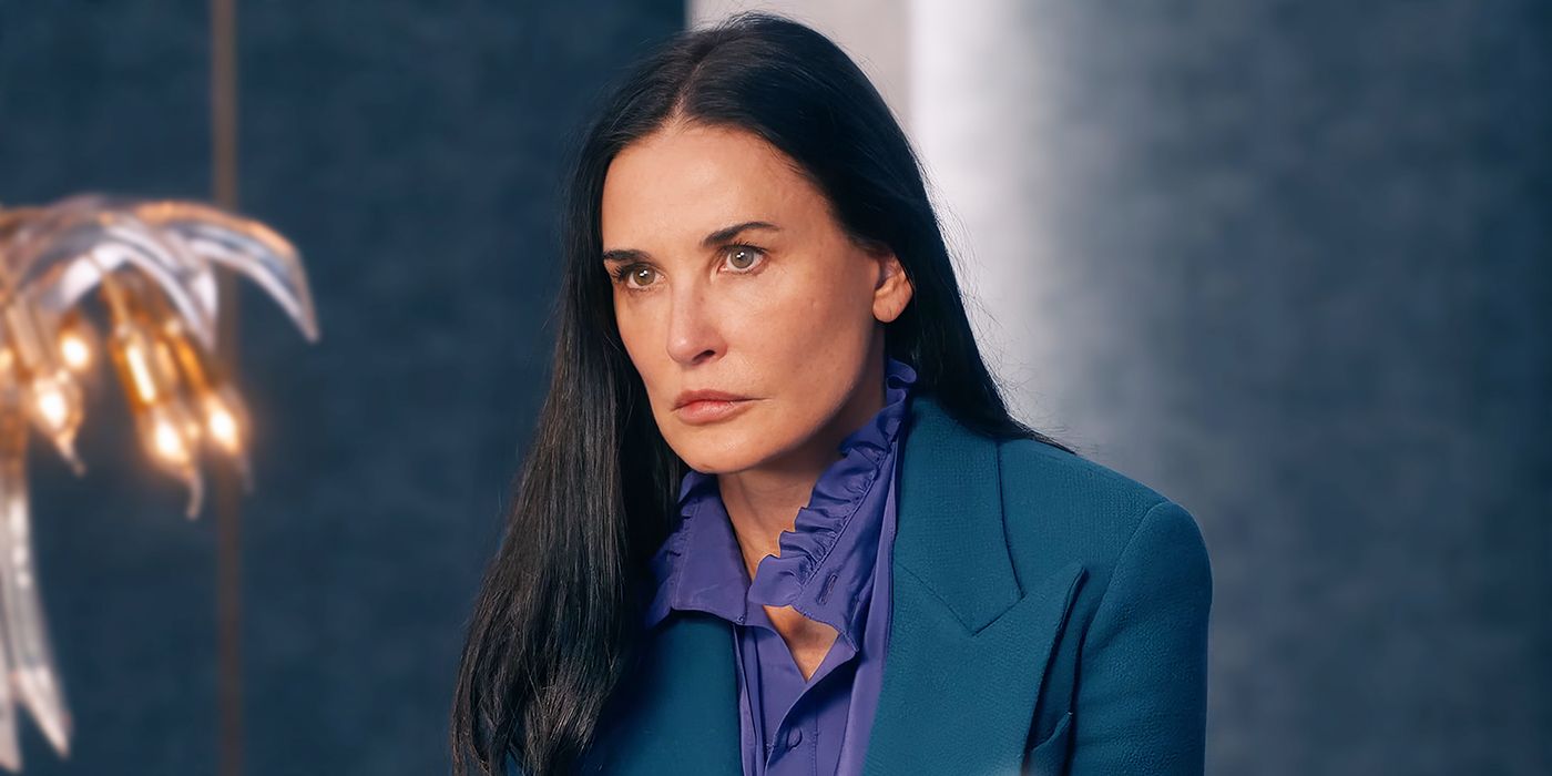 Demi Moore as Elizabeth Sparkle staring intently at a television screen in The Substance. 