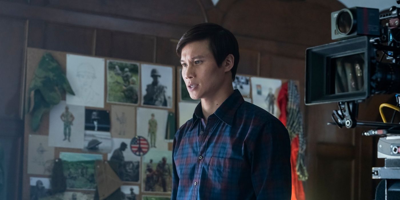 Hoa Xuande standing in front of a camera in The Sympathizer Episode 4