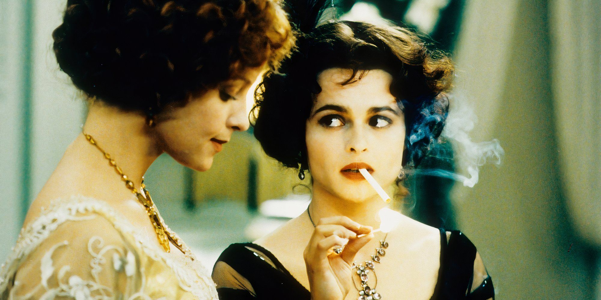 Helena Bonham Carter as Kate Croy smoking while looking at another young woman in The Wings of the Dove.