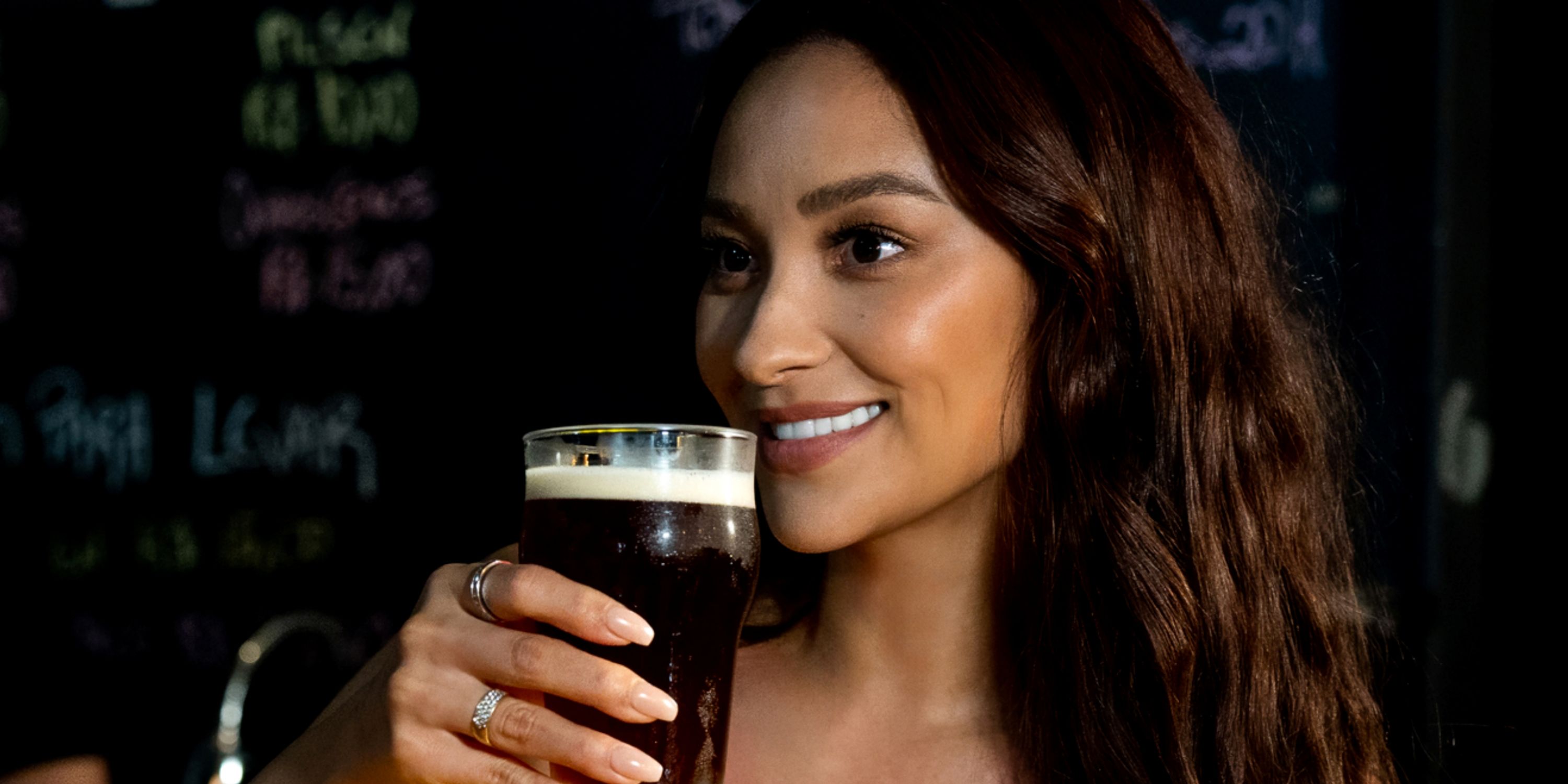 Shay Mitchell having a beer as the host of the travel series Thirst with Shay Mitchell