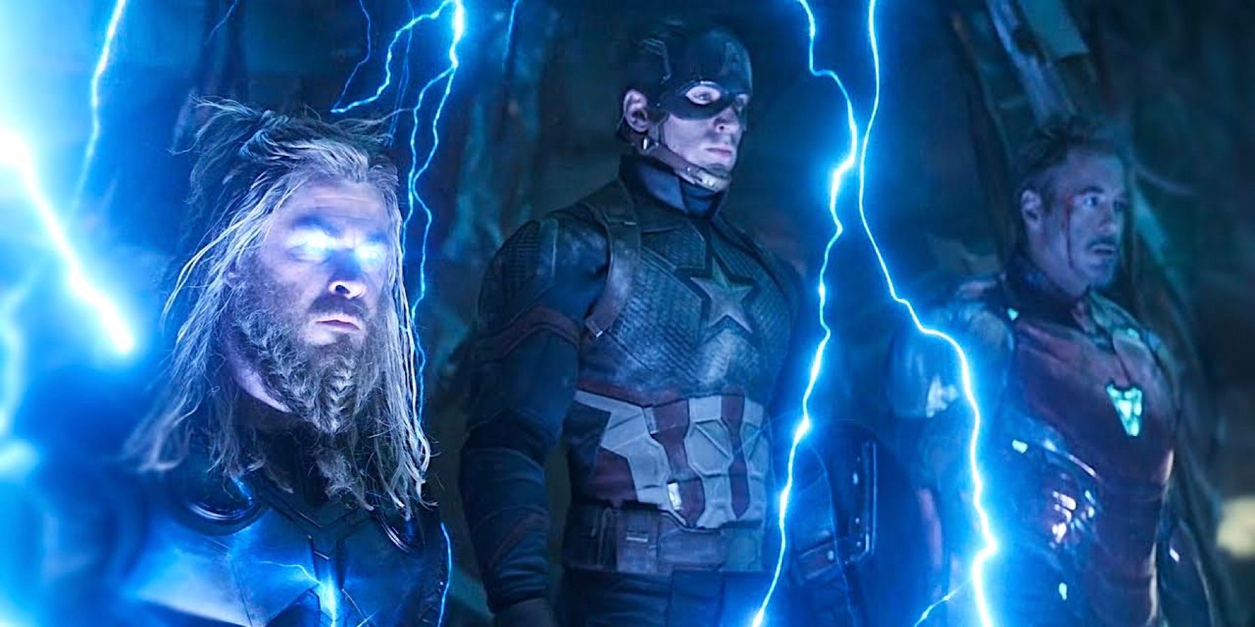 Thor, Captain America, and Iron Man look solemn as lightning crackles around them in Avengers: Endgame.