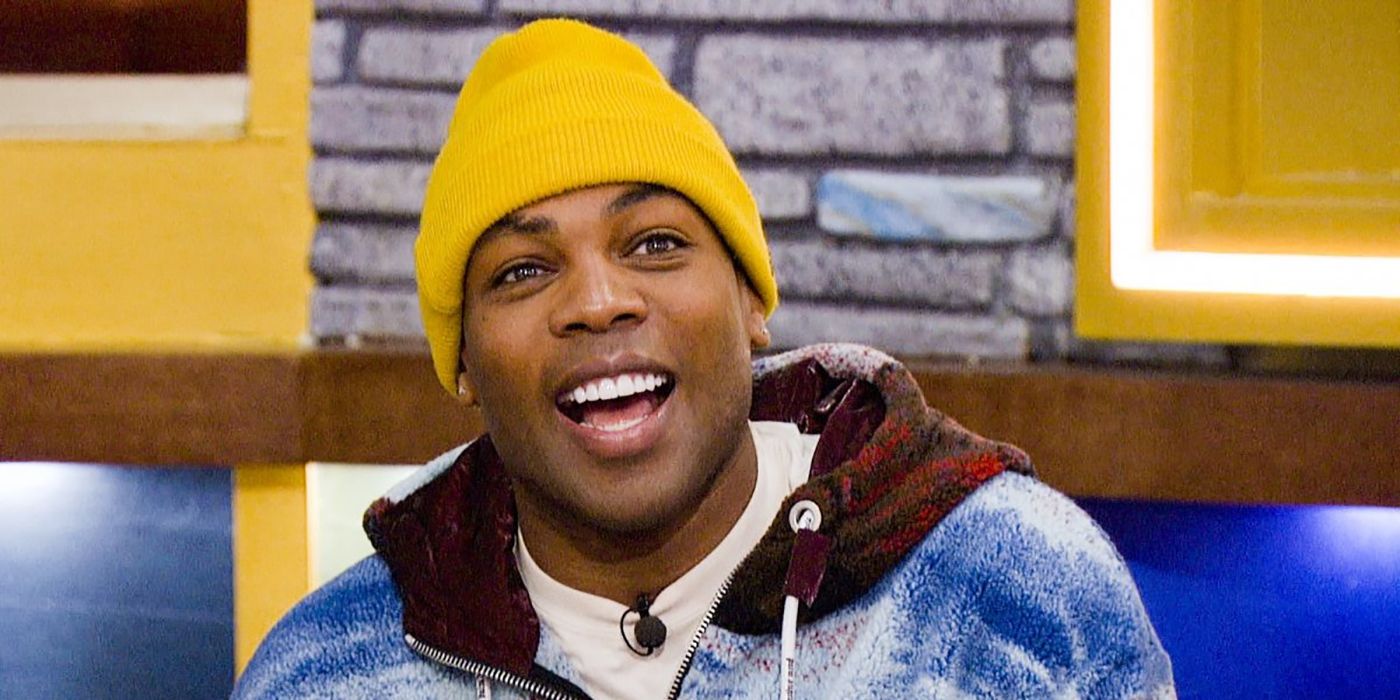 Todrick Hall on Celebrity Big Brother smiling, wearing a yellow beanie hat.