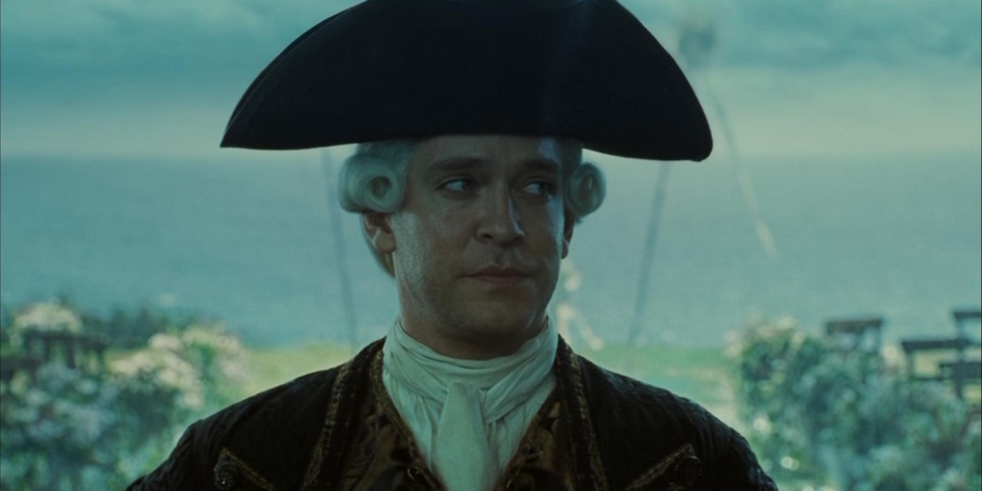 Lord Cutler Beckett smiling in Pirates of the Caribbean Dead Man's Chest