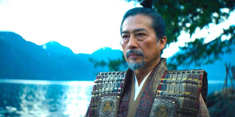 Toranaga looking serious standing by the water in Shogun.
