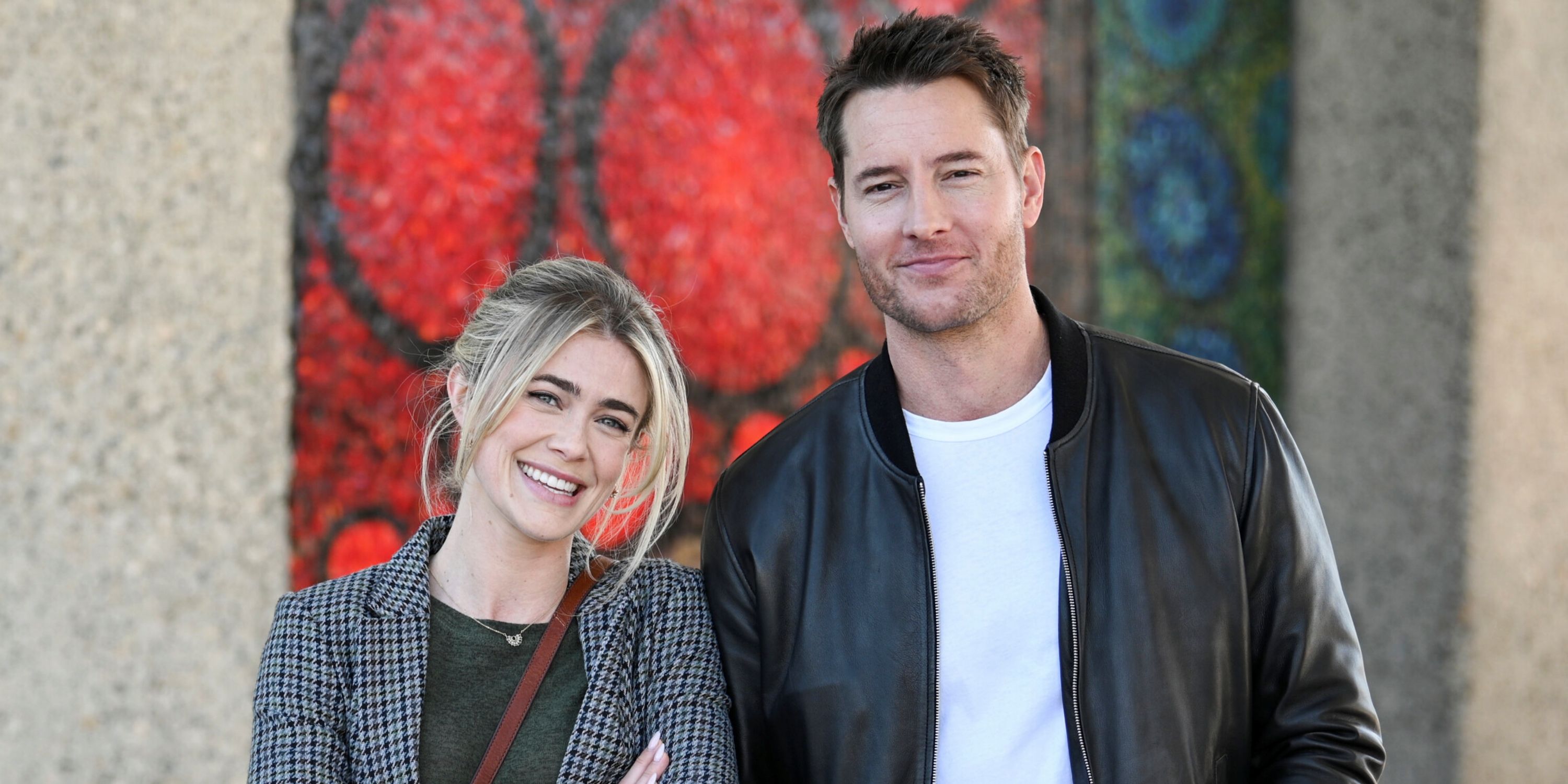 Justin Hartley as Colter Shaw standing with Melissa Roxburgh as his sister Dory, both smiling, in Tracker