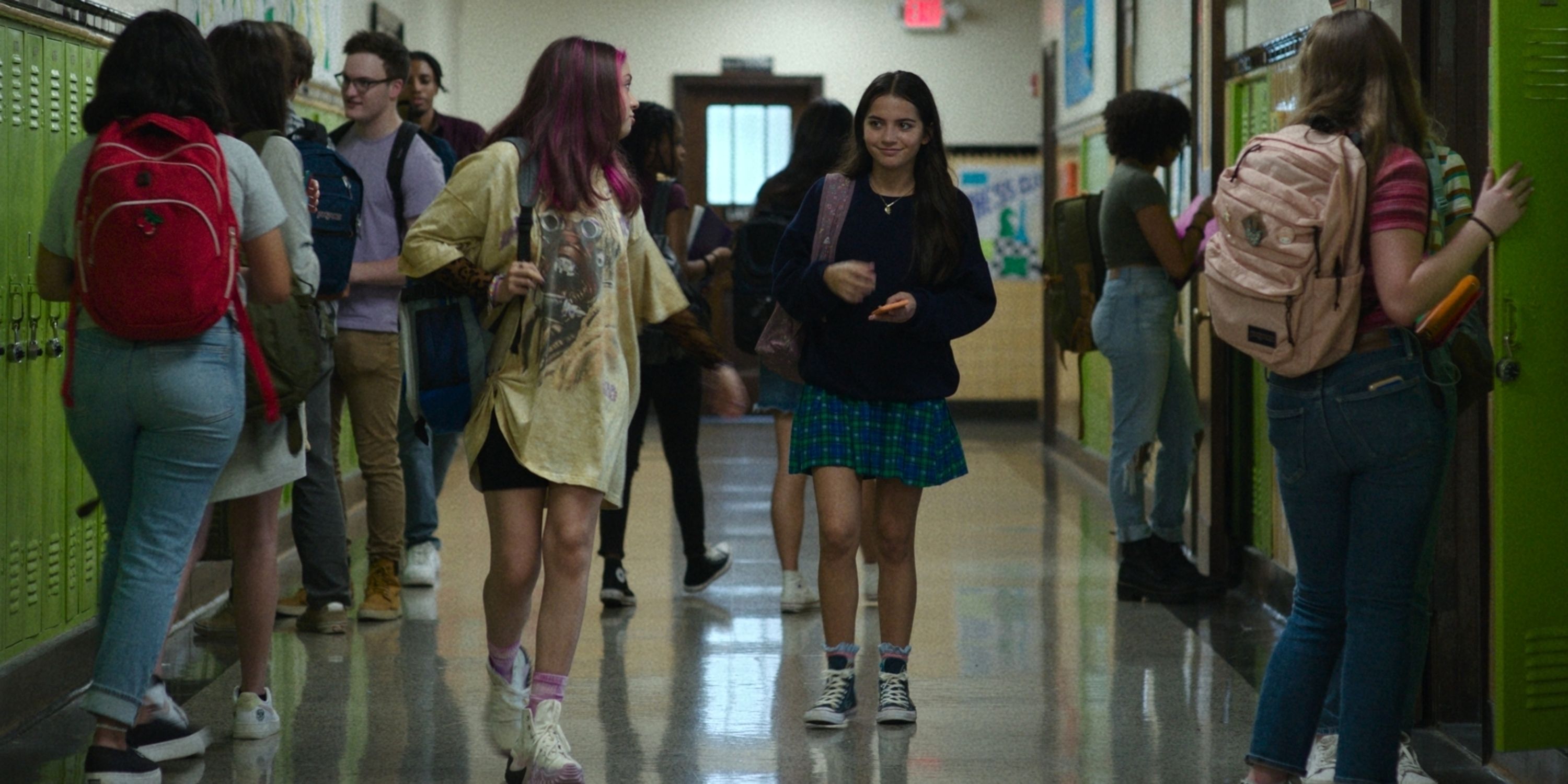 Isabela Merced as Aza and Cree as Daisy walking down the hallway of high school in Turtles All the Way Down