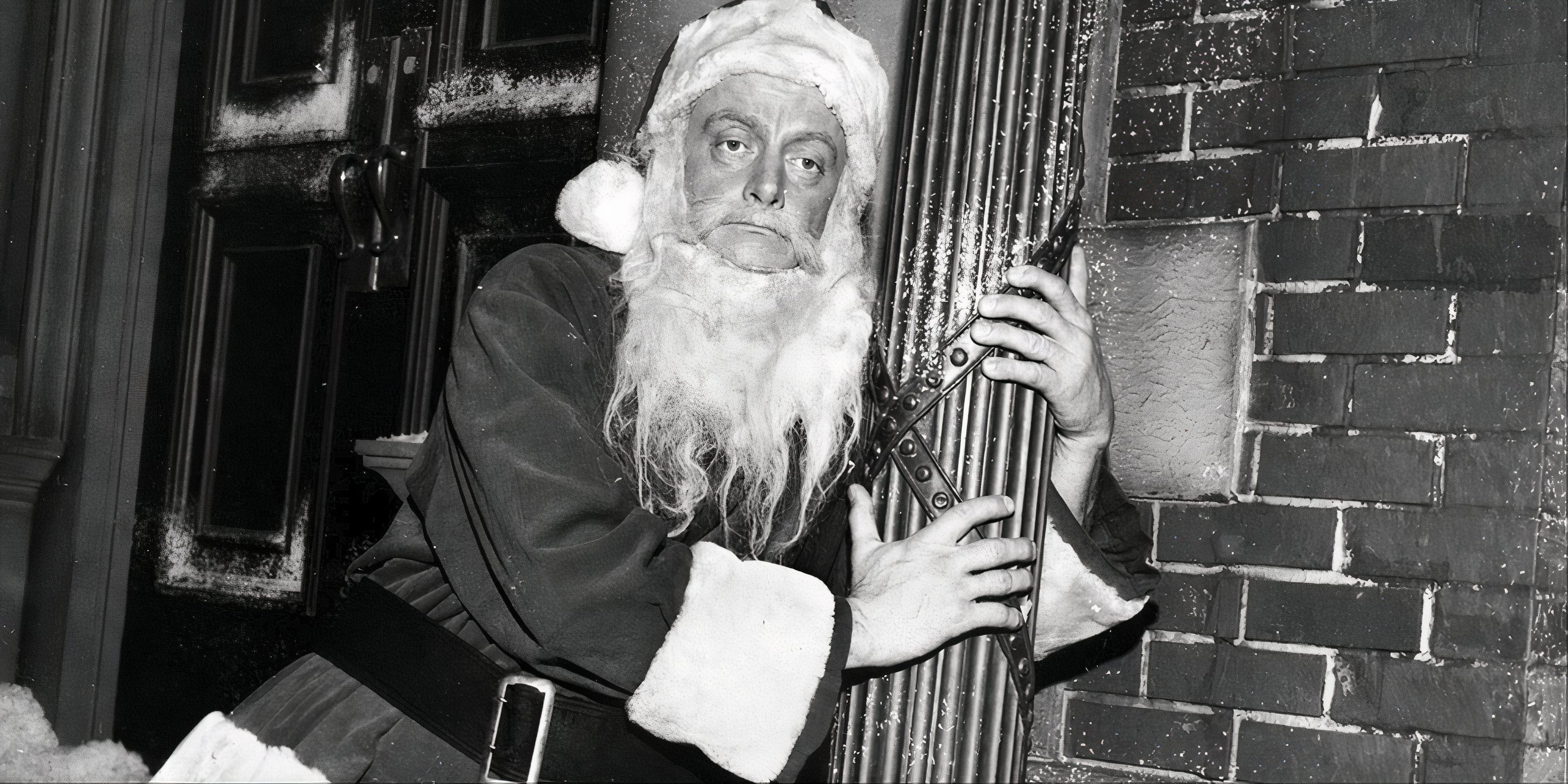 Art Carney dressed as Santa Claus holding on to a light pole looking drunk in The Twilight Zone