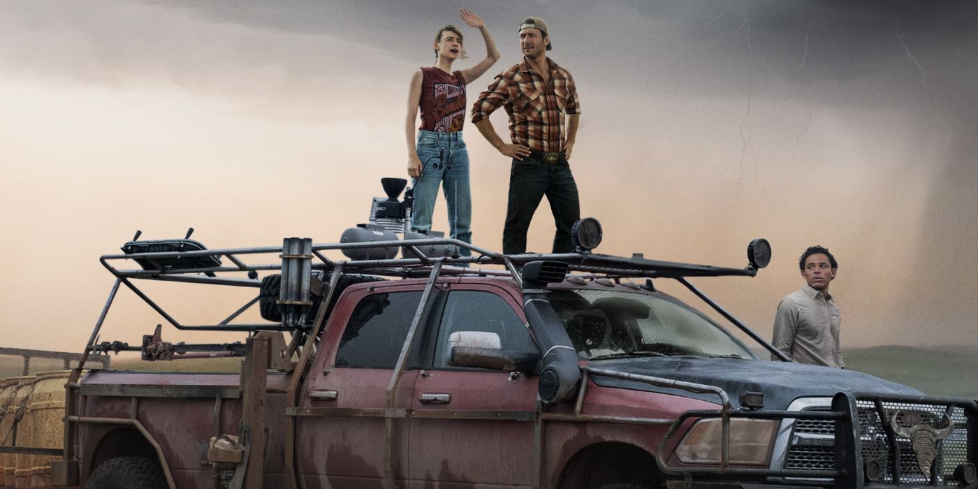 Daisy Edgar-Jones, Glen Powell, and Anthony Ramos posing by a red storm-proof truck on the poster for Twisters.