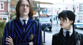 Wednesday (Jenna Ortega) glares at Xavier Thorpe (Percy Hynes White) in Wednesday Season 1.