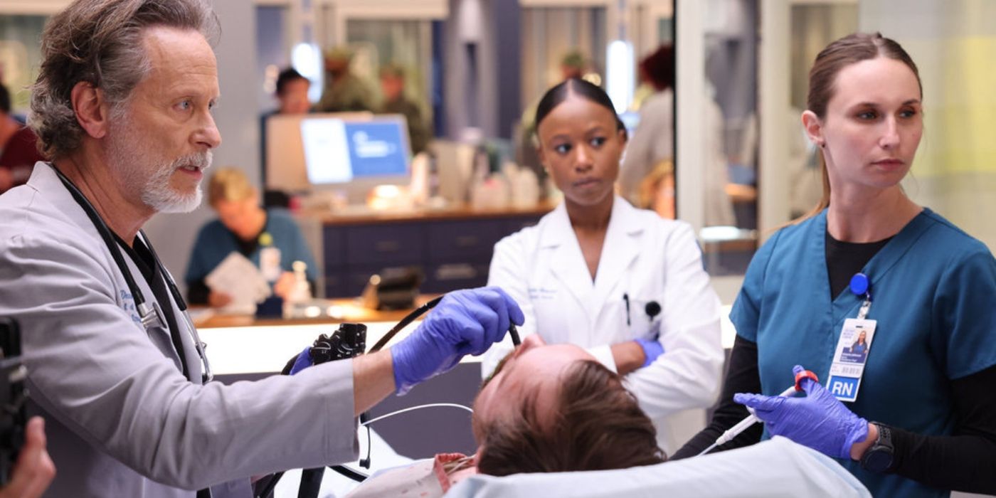  Steven Weber as Dr. Dean Archer and Ashlei Sharp Chestnut as Naomi Howard treating a patient in the ER in Chicago Med Season 9, Episode 13 