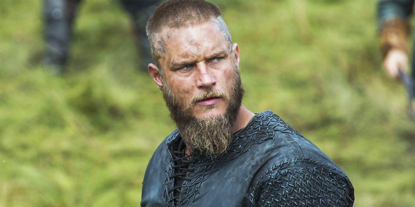 Travis Fimmel as Ragnar looks over his shoulder frowning at Vikings