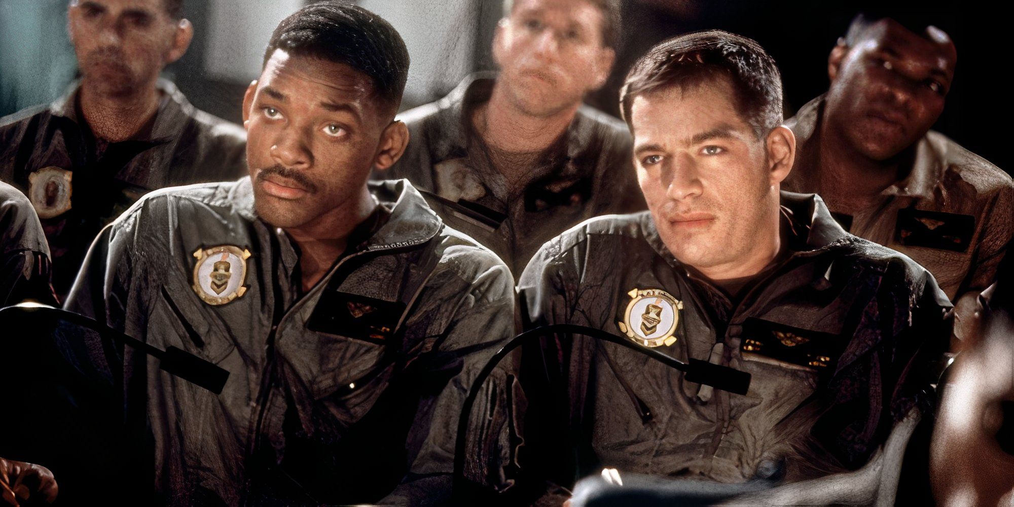 Will Smith and Harry Connick Jr. sitting next to each other in Independence Day (1996)