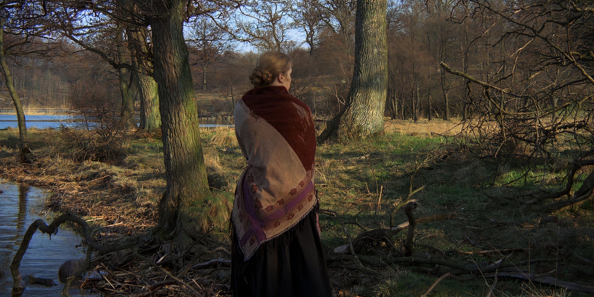 A woman stands in the forest with her back to camera in The New Land (1972)