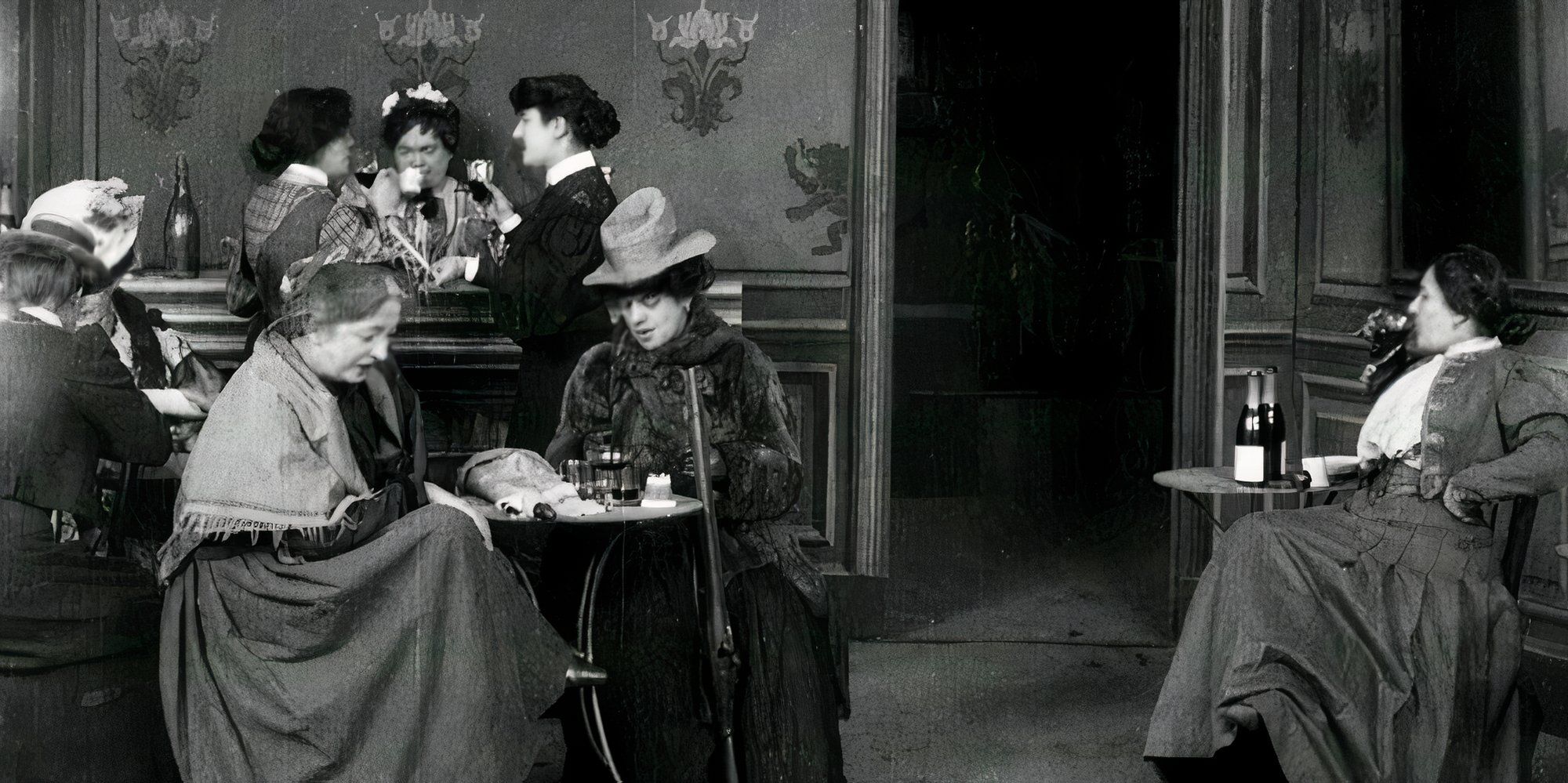 Women sitting at various cafe tables in The Consequences of Feminism.