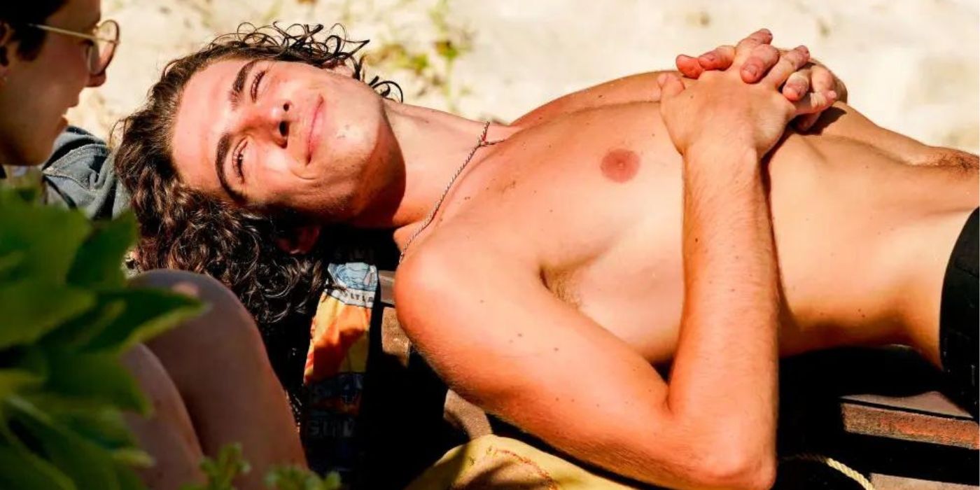 Xander Hastings lounging on the beach during 'Survivor 41.'