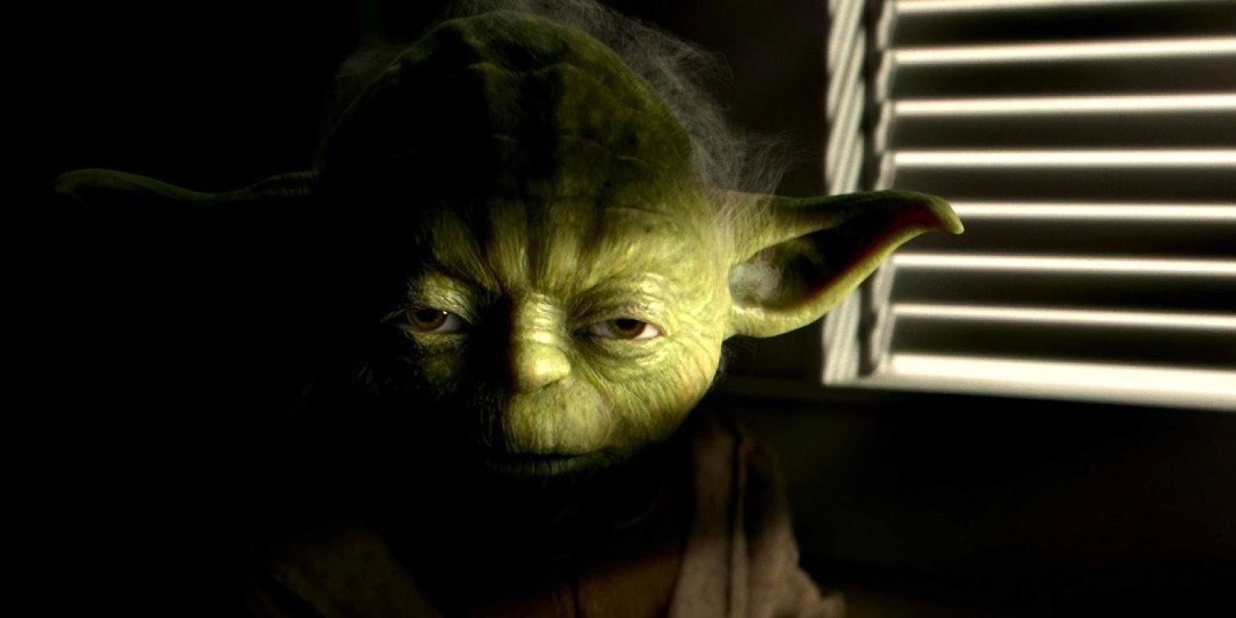 Jedi Master Yoda sits half in shadow inside his meditation chamber in Star Wars: Episode III - Revenge of the Sith.