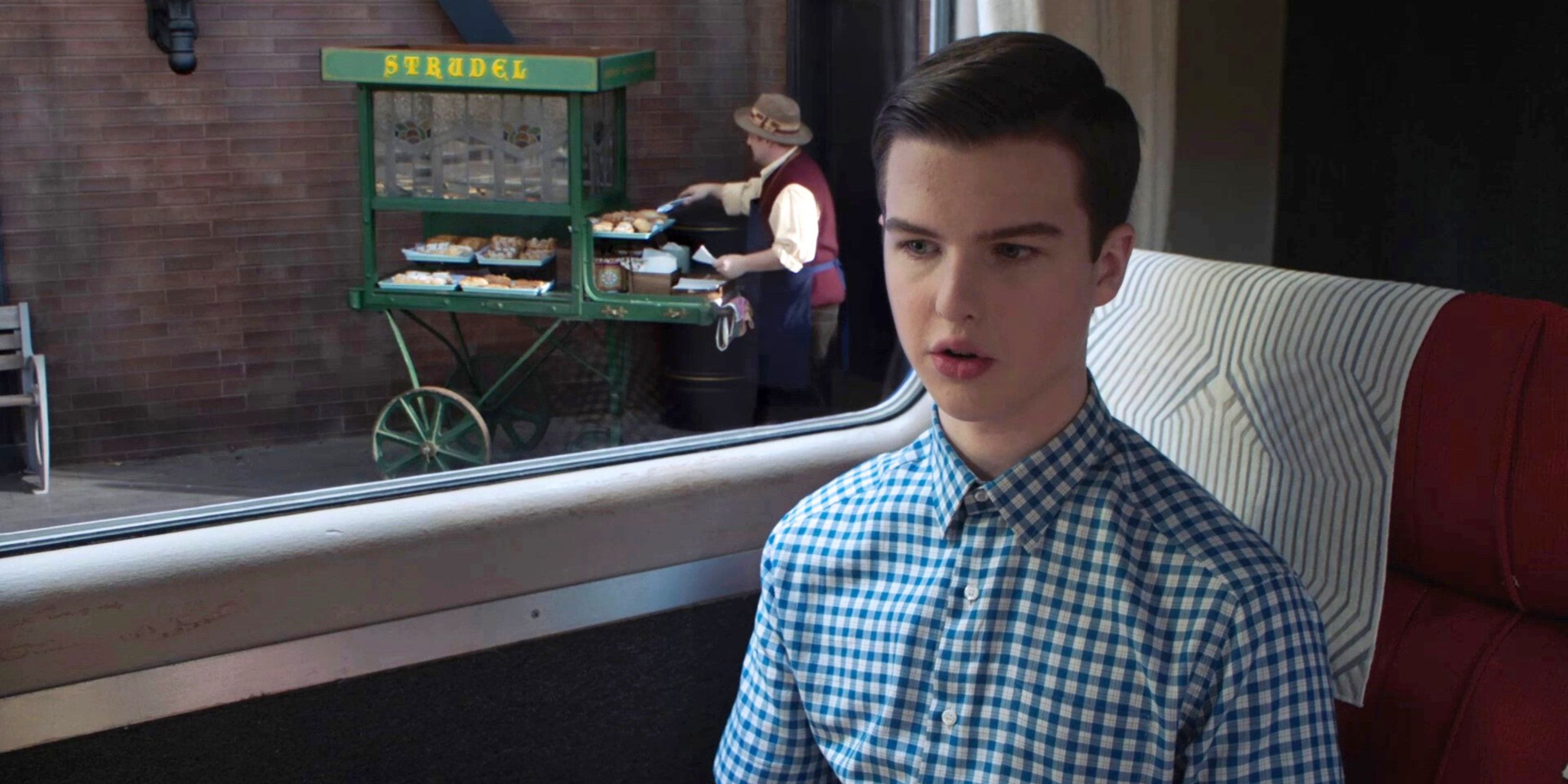 Sheldon Cooper, played by Iain Armitage, on a train in Germany in 'Young Sheldon'
