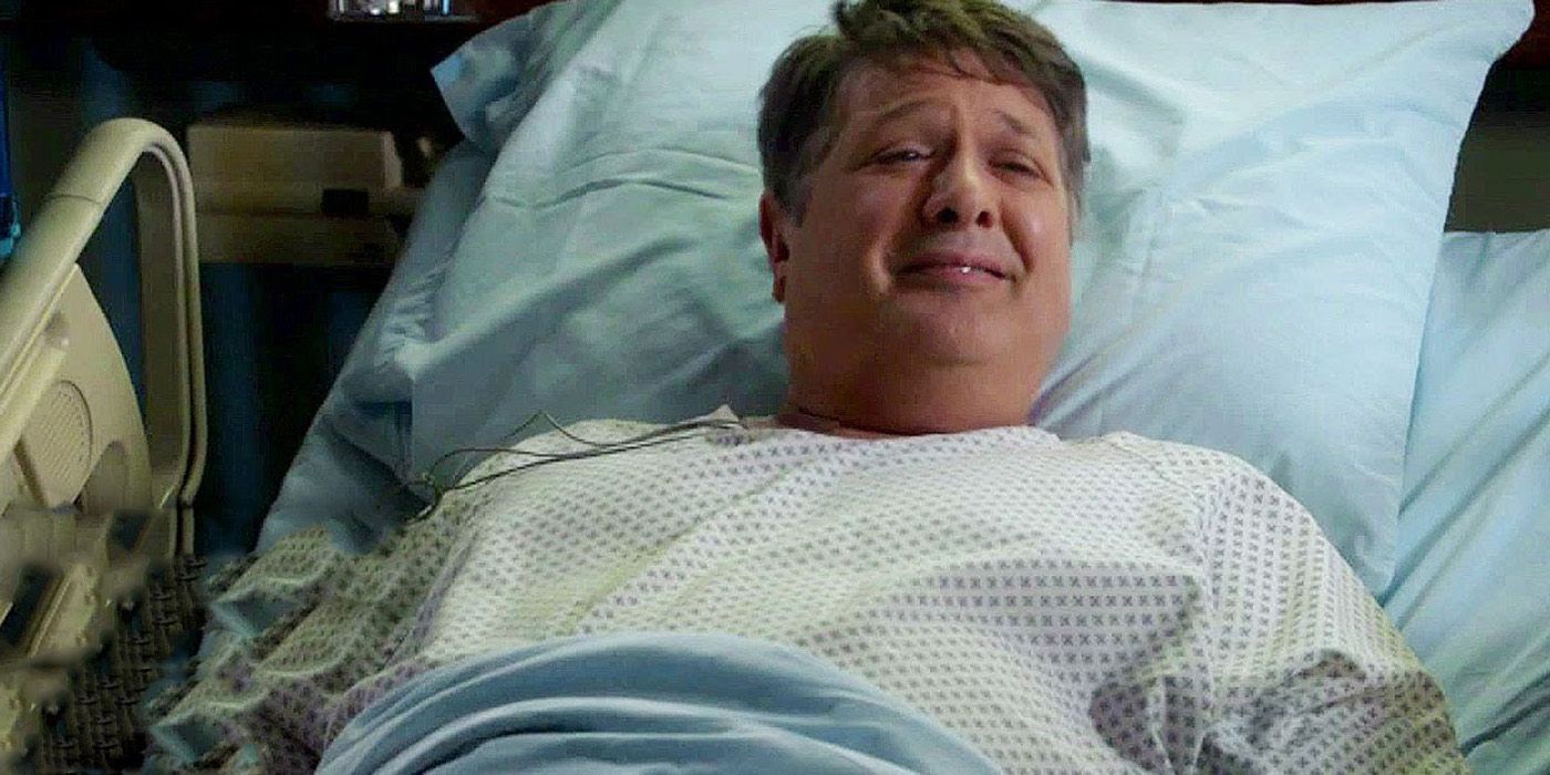 George in Young Sheldon in a hospital bed smiling.