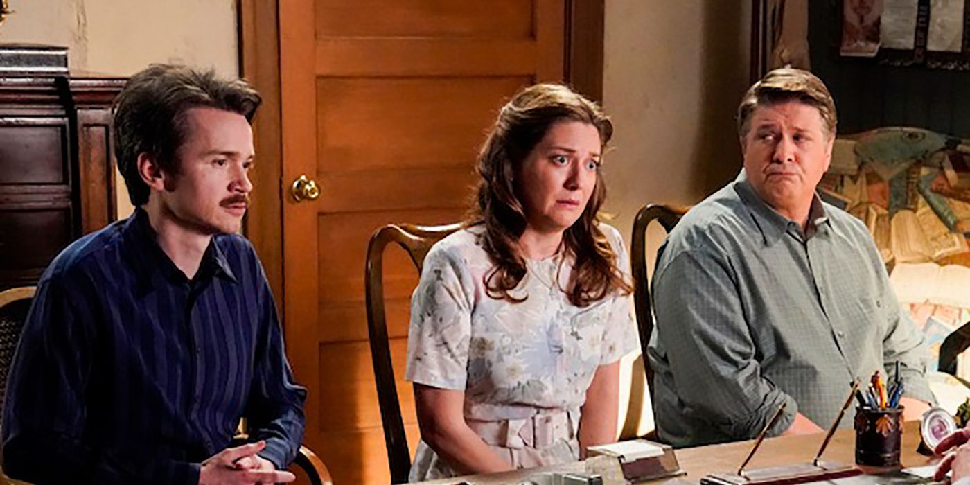 Mary sitting between Pastor Rob and George in Pastor Jeff's office on Young Sheldon, looking worried.