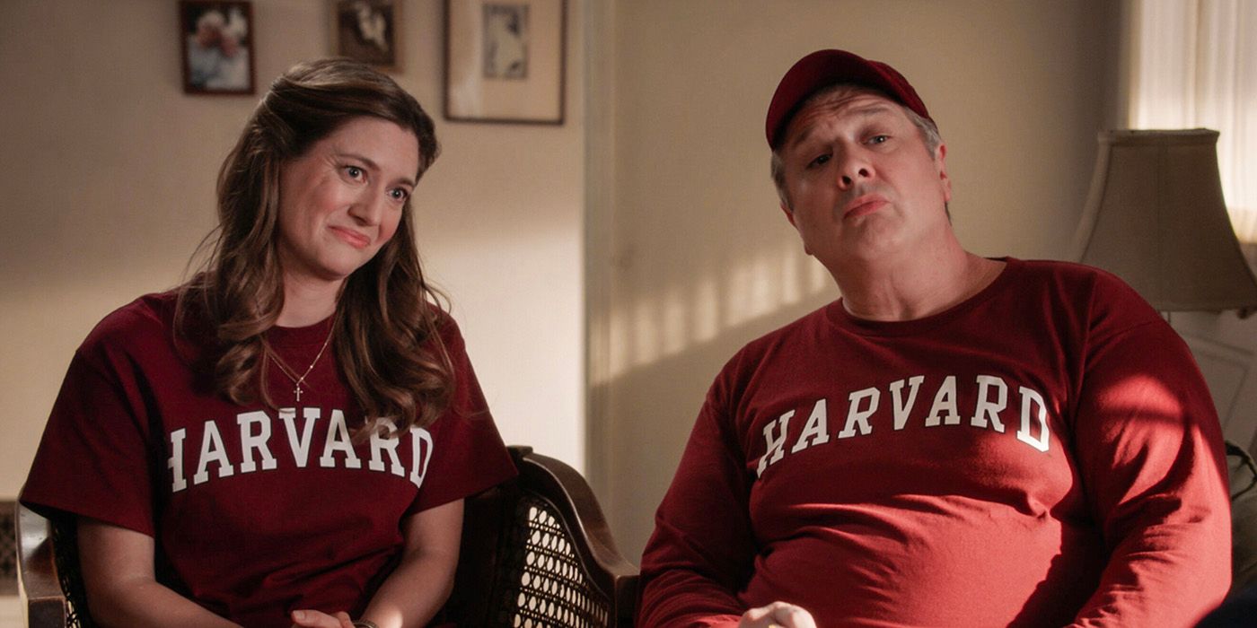 Zoe Perry as Mary Cooper and Lance Barber as George Cooper wearing Harvard shirts in Young Sheldon