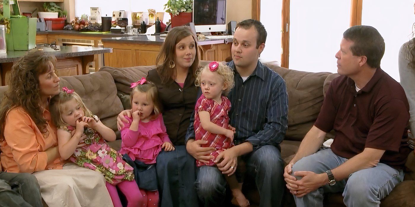 Josh Duggar sitting on a couch with his family