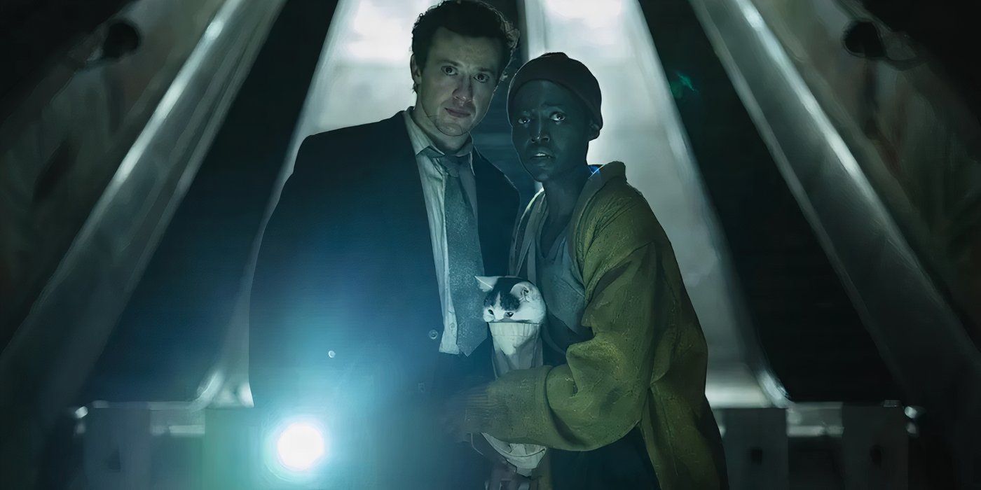 Joseph Quinn as Eric and Lupita Nyong'o as Sam with Frodo the cat in A Quiet Place: Day One