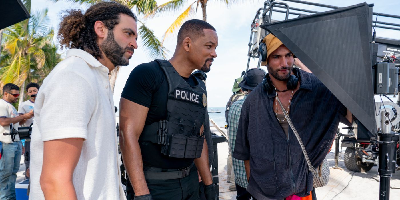 Adil El Arbi, Will Smith, and Bilall Fallah looking at a monitor on the set of Bad Boys: Ride or Die.