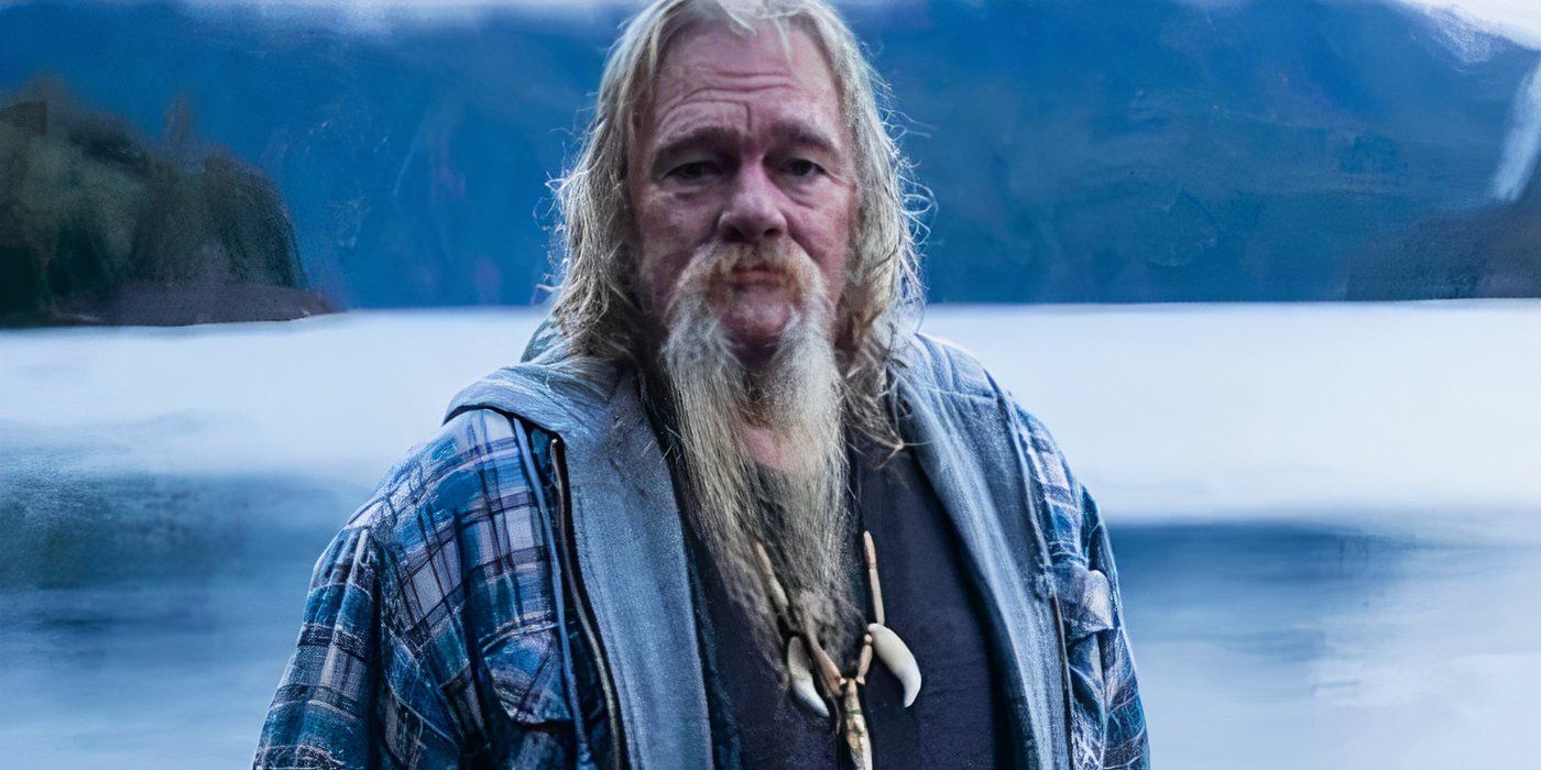 Billy Brown of 'Alaskan Bush People' taking a photo by an Alaskan lake