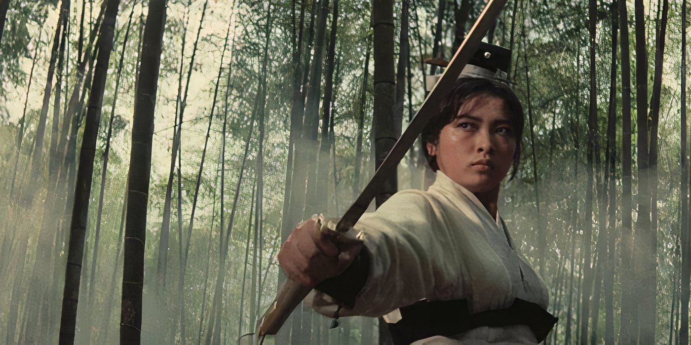 Yang Hui-zhen, wielding a quarterstaff in a forest in A Touch of Zen